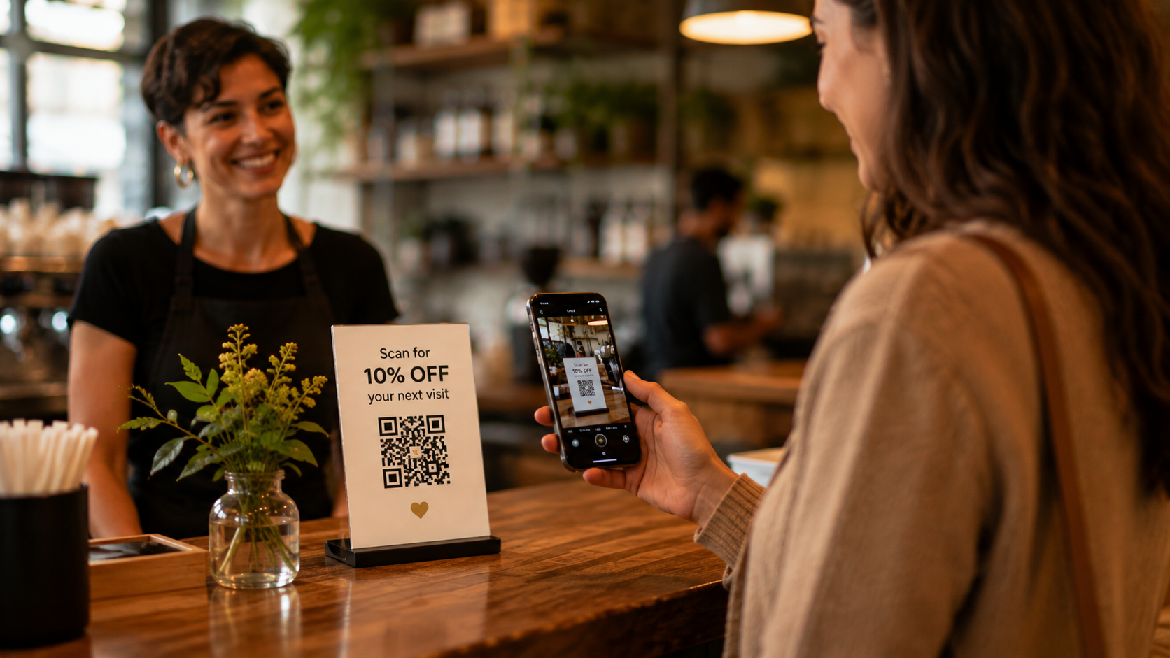 Customer scanning a QR code offering ten percent off a future visit
