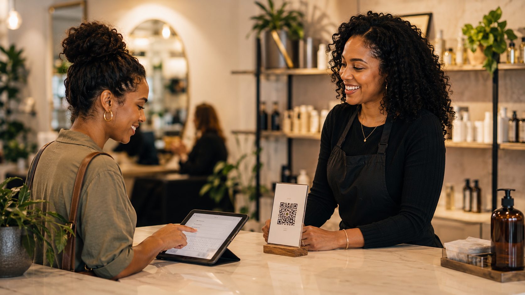 Salon customer entering contact information on a tablet at checkout